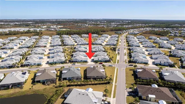 an aerial view of residential building and ocean