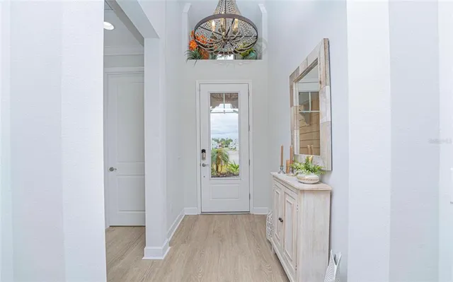 a view of an entryway with wooden floor