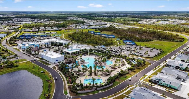 a view of a swimming pool with outdoor seating and yard
