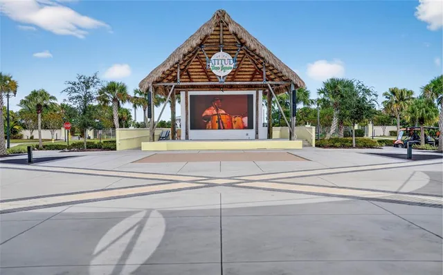 a swimming pool with outdoor seating