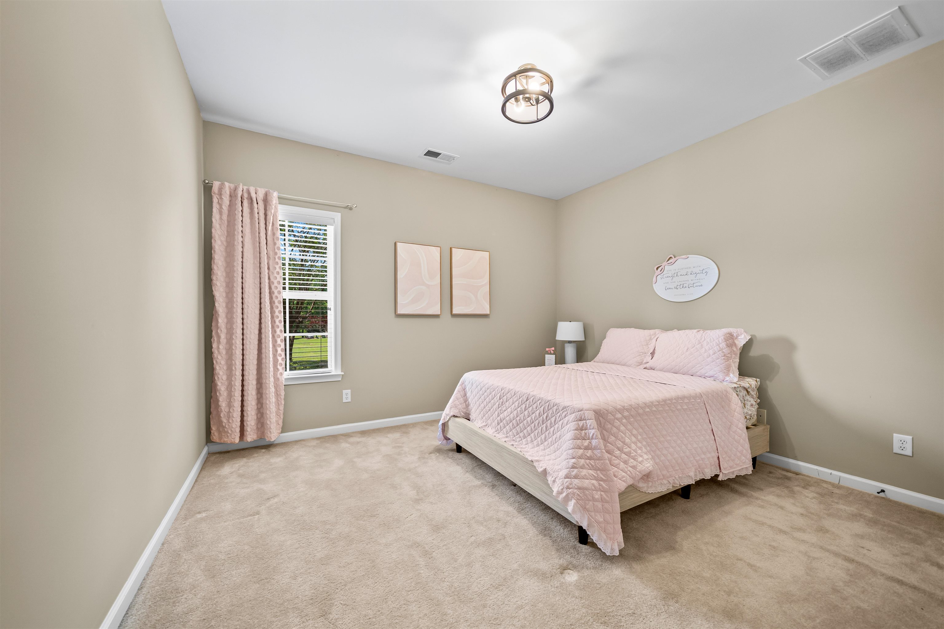 5035 Brian Ridge Road Arlington, TN 38002 - Photo 23 of 40 Carpeted interior room with neutral-toned walls, featuring a single window with white trim, a ceiling-mounted light fixture, and white baseboards