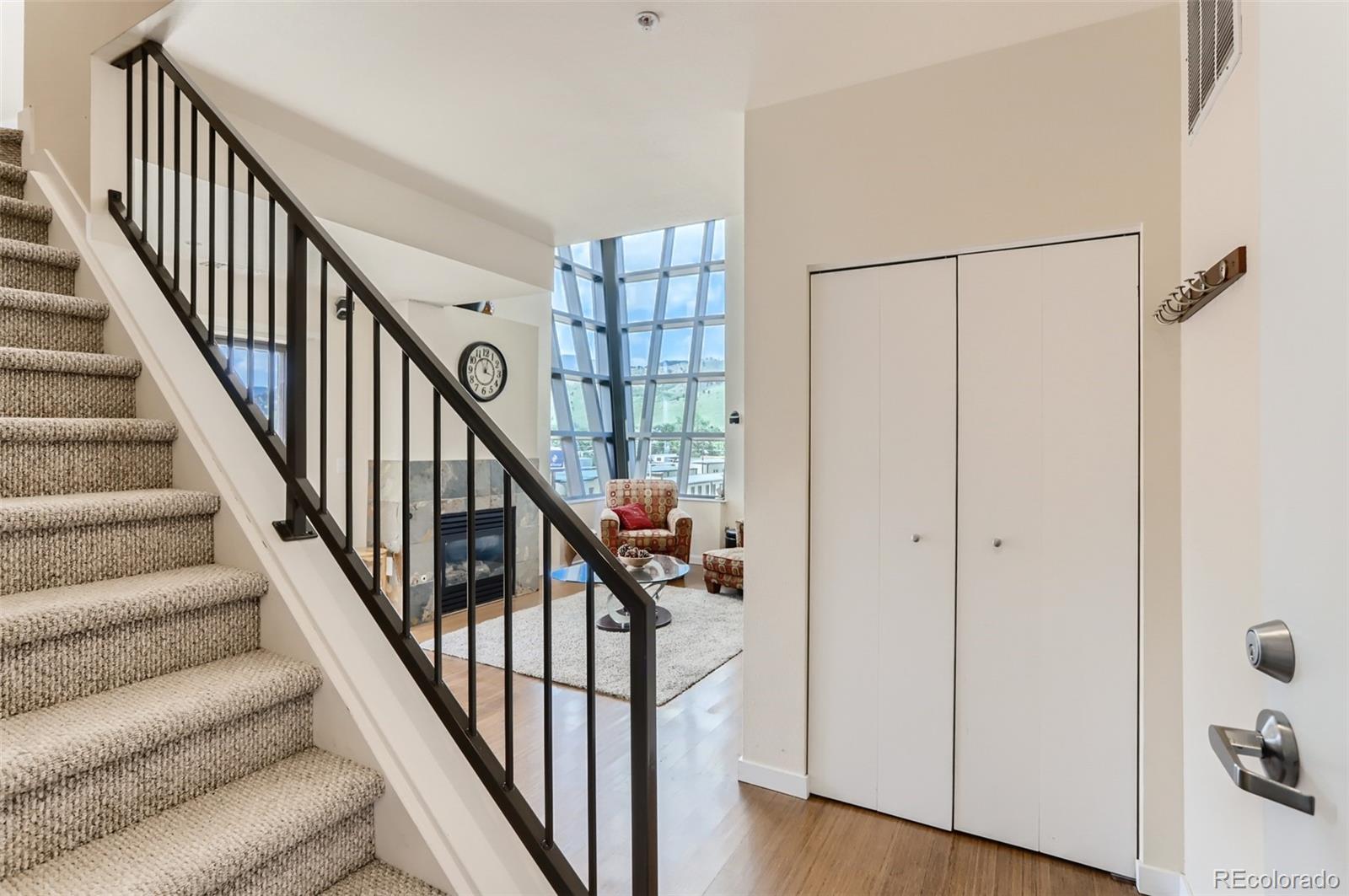 4580 Broadway, Unit 223 Boulder, CO 80304 - Photo 14 of 28 a view of staircase with wooden floor and fan