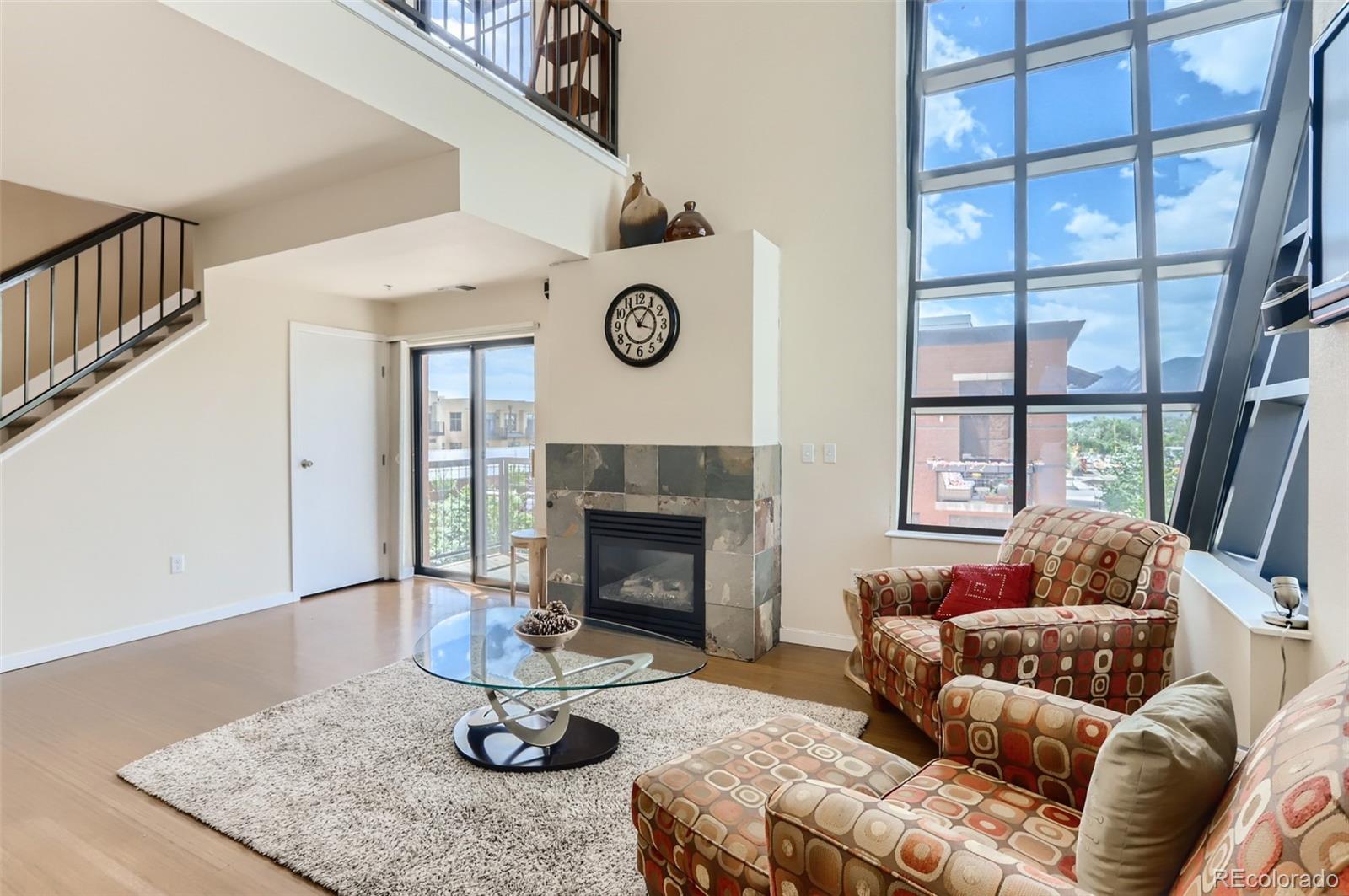 4580 Broadway, Unit 223 Boulder, CO 80304 - Photo 3 of 28 a living room with furniture and a fireplace