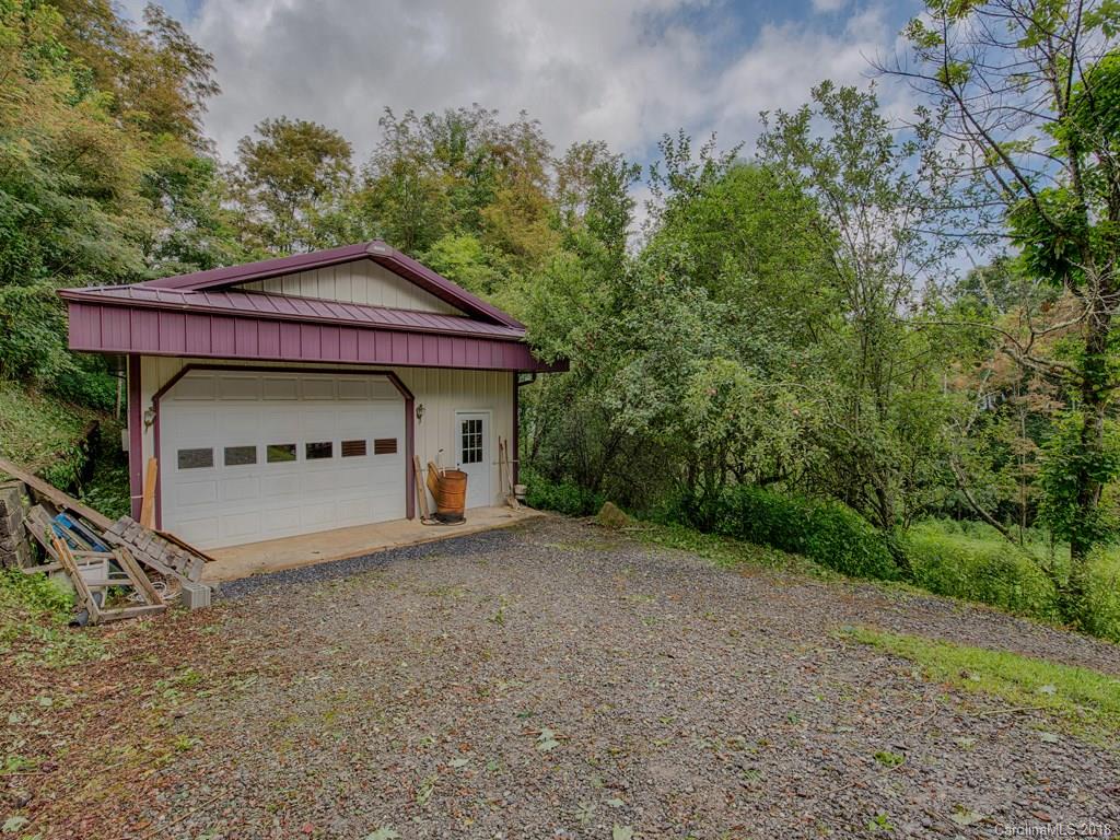 772 Red Bank Road, Unit PT 7 & 35 Waynesville, NC 28786 - Photo 22 of 34 a view of a house with a yard and garage