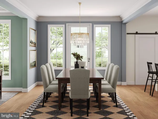 a dining room with furniture a rug and wooden floor