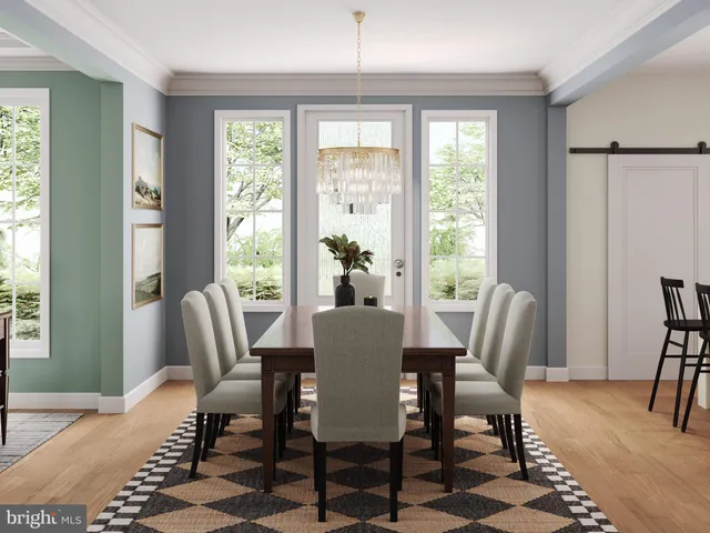 a dining room with furniture a rug and wooden floor