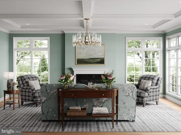 a living room with furniture a fireplace and large windows
