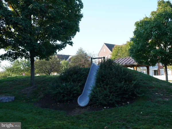 a view of a house with a yard and garden