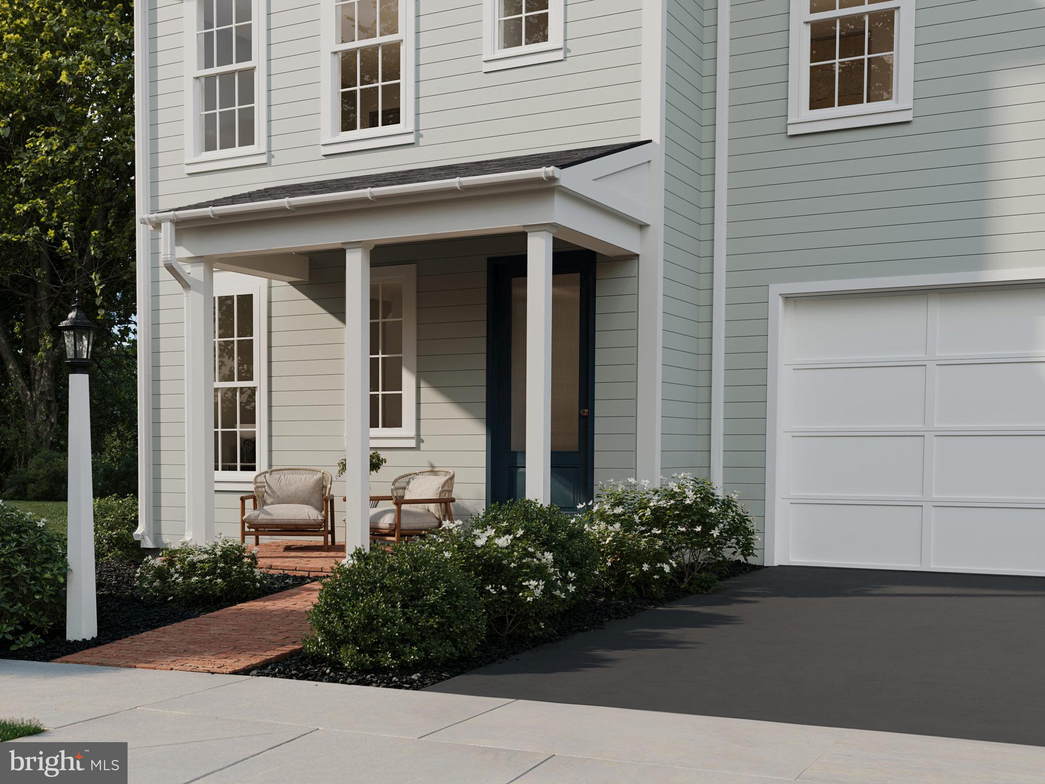 104 Merchant Avenue, Unit ELGIN Mount Joy, PA 17552 - Photo 6 of 34 a front view of a house with garden