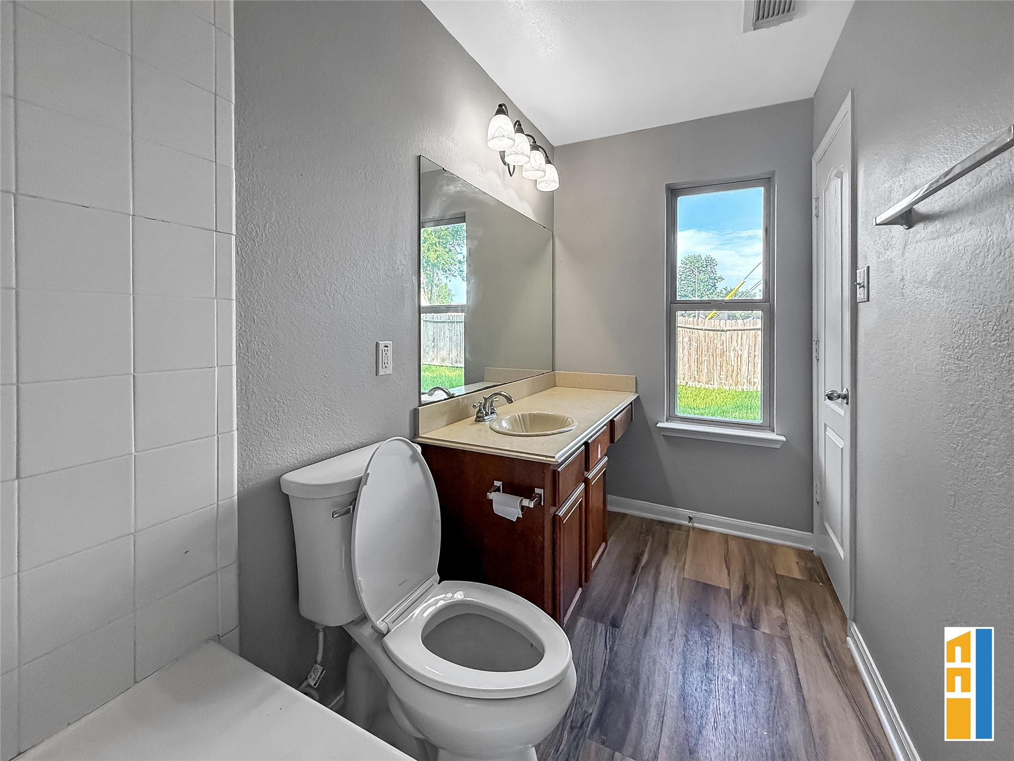 29566 North Legends Bend Drive Spring, TX 77386 - Photo 15 of 21 This inviting primary bathroom boasts modern elegance with sleek fixtures, a large mirror, and abundant natural light, creating a perfect blend of style and comfort.