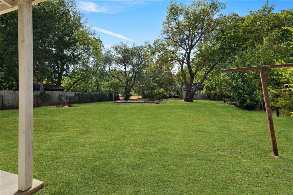 2411 Denison Street Denton, TX 76201 - Photo 13 of 15 a view of a garden with a tree