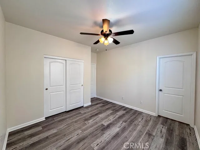 a bathroom with a toilet a sink a mirror and shower