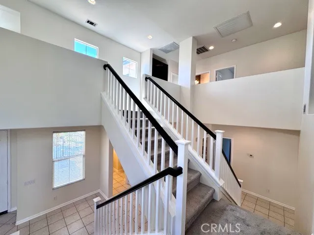 a view of livingroom with window and stairs