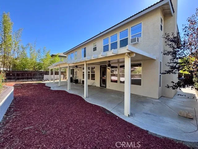 a view of house with a yard