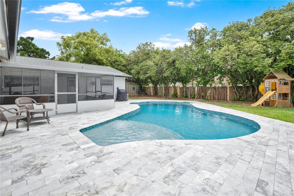 4222 Old Dominion Road Orlando, FL 32812 - Photo 2 of 49 a view of a backyard with a patio