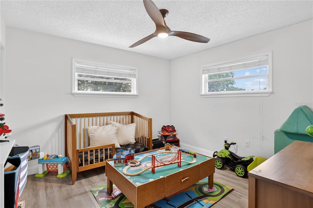 4222 Old Dominion Road Orlando, FL 32812 - Photo 22 of 49 a living room with furniture and paintings on the wall