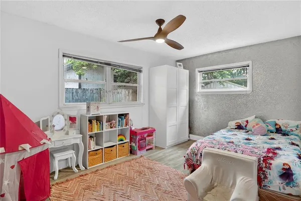 a bedroom with a bed and a book shelf