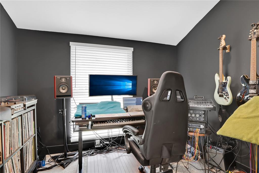 4222 Old Dominion Road Orlando, FL 32812 - Photo 25 of 49 a room with furniture a rug and a window