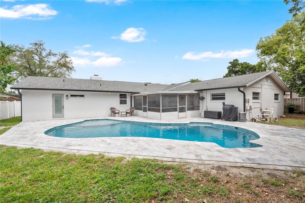 4222 Old Dominion Road Orlando, FL 32812 - Photo 30 of 49 a front view of house with yard and swimming pool