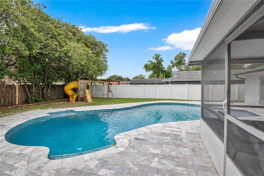 4222 Old Dominion Road Orlando, FL 32812 - Photo 32 of 49 a view of a swimming pool with a patio