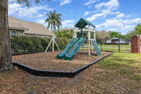 a view of outdoor space playground and green space