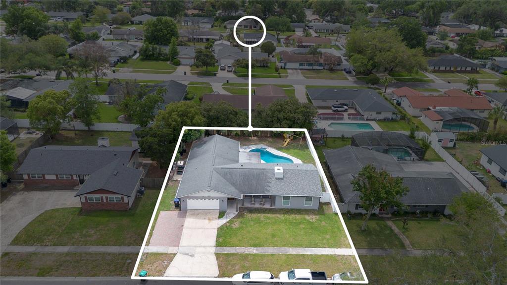 4222 Old Dominion Road Orlando, FL 32812 - Photo 38 of 49 a view of swimming pool with a table and chairs