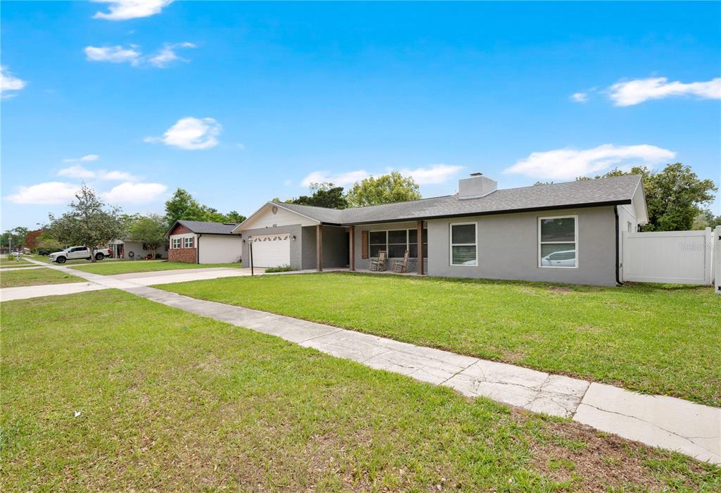 4222 Old Dominion Road Orlando, FL 32812 - Photo 44 of 49 a view of an house with backyard and a tree