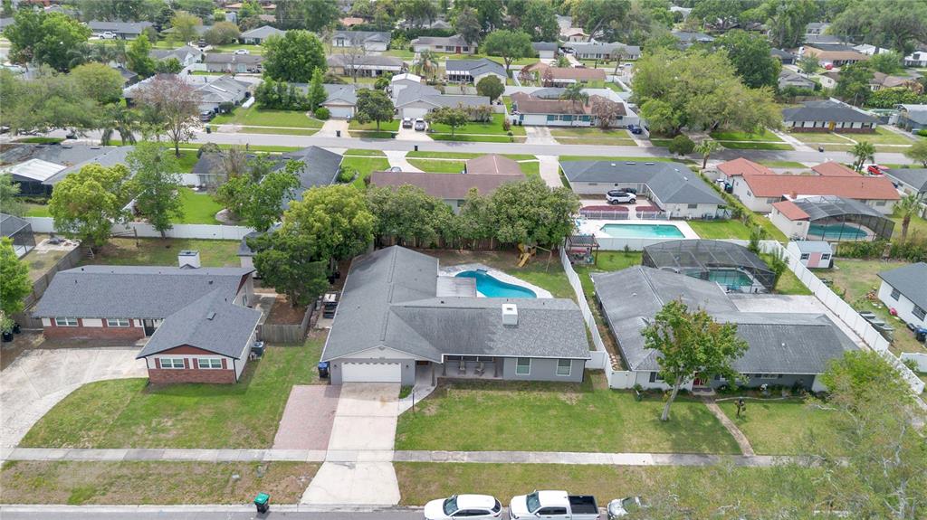 4222 Old Dominion Road Orlando, FL 32812 - Photo 45 of 49 an aerial view of residential houses with outdoor space and swimming pool