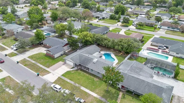 an aerial view of residential houses with outdoor space