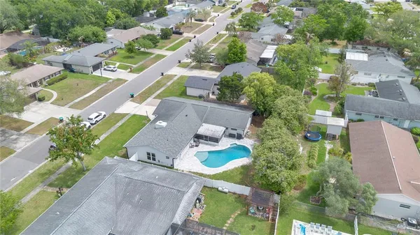an aerial view of residential houses with outdoor space