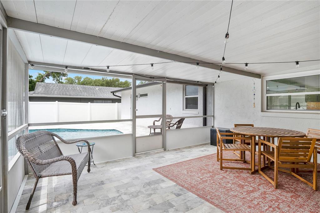 4222 Old Dominion Road Orlando, FL 32812 - Photo 5 of 49 a outdoor space with lots of tables a mirror and furniture