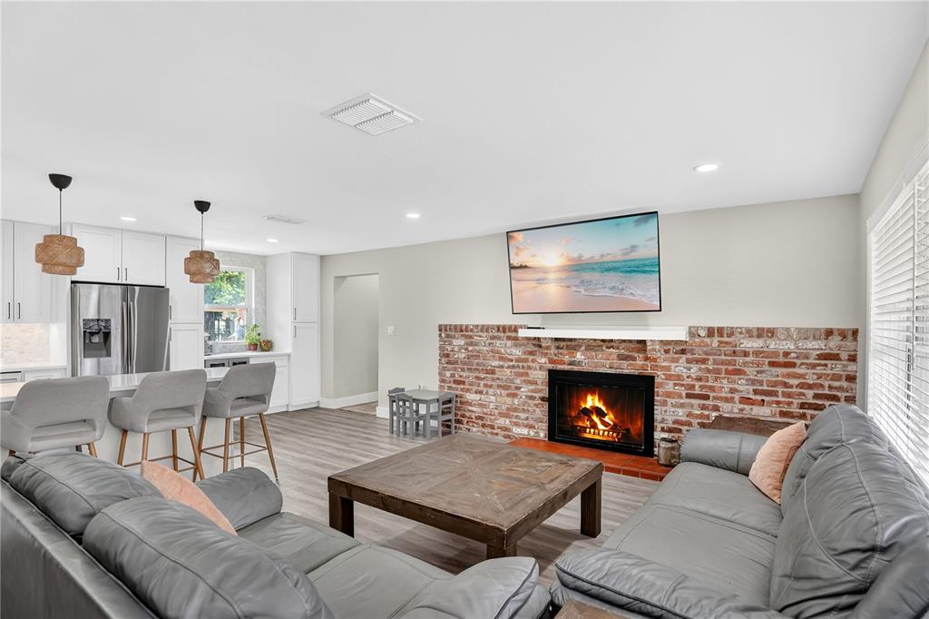 4222 Old Dominion Road Orlando, FL 32812 - Photo 6 of 49 a living room with furniture and a fireplace