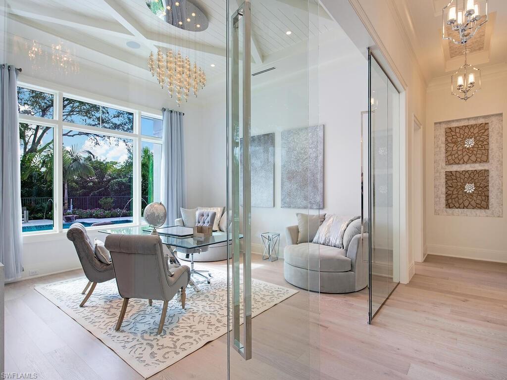 714 Killdeer Place Naples, FL 34108 - Photo 14 of 34 a living room with furniture and a large window