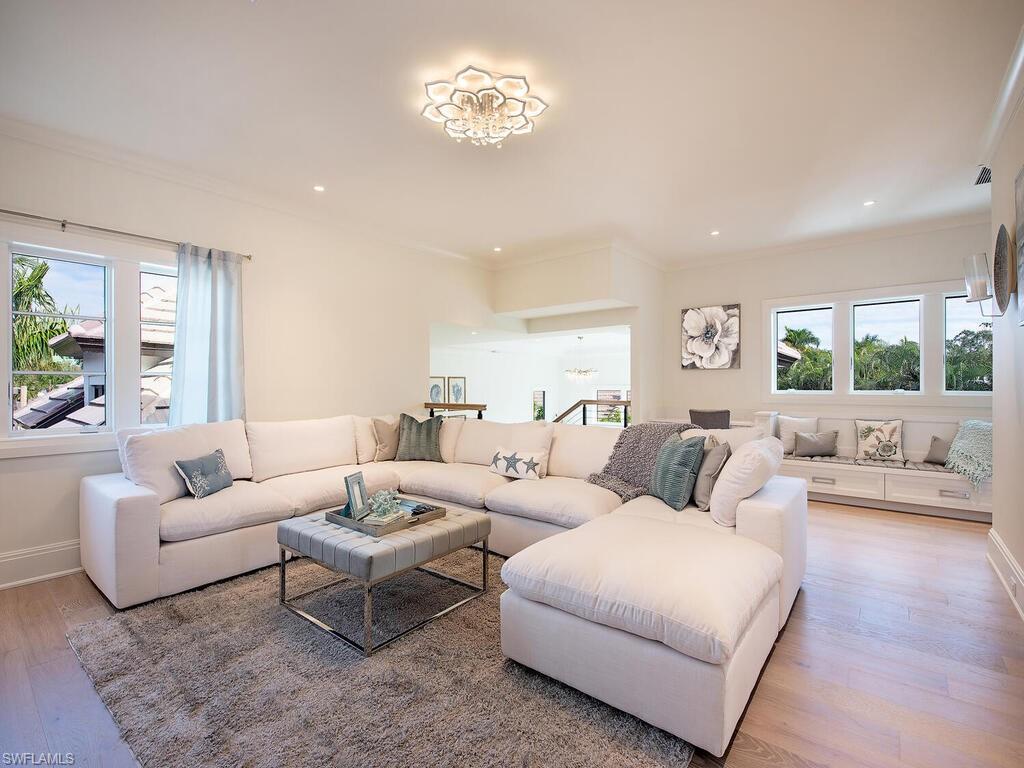 714 Killdeer Place Naples, FL 34108 - Photo 16 of 34 a living room with furniture and a large window