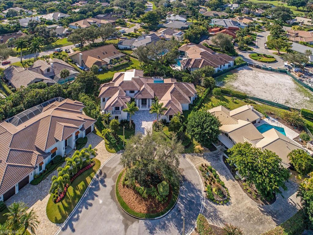 714 Killdeer Place Naples, FL 34108 - Photo 2 of 34 an aerial view of residential houses with outdoor space