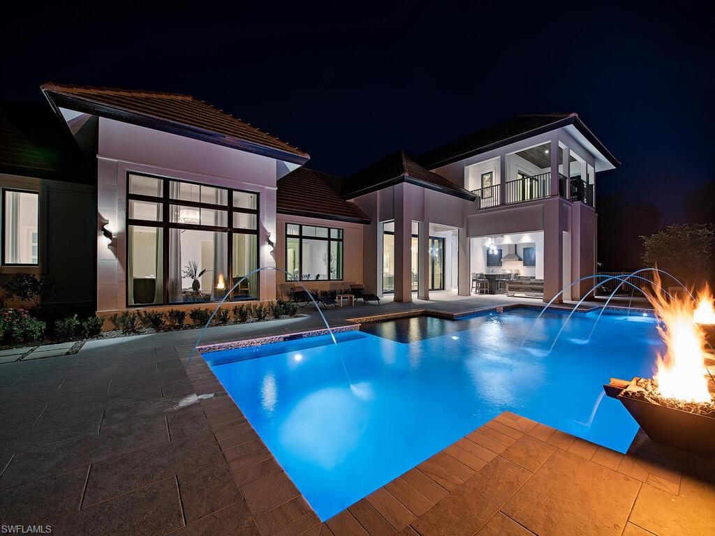 714 Killdeer Place Naples, FL 34108 - Photo 25 of 34 a view of swimming pool with seating area