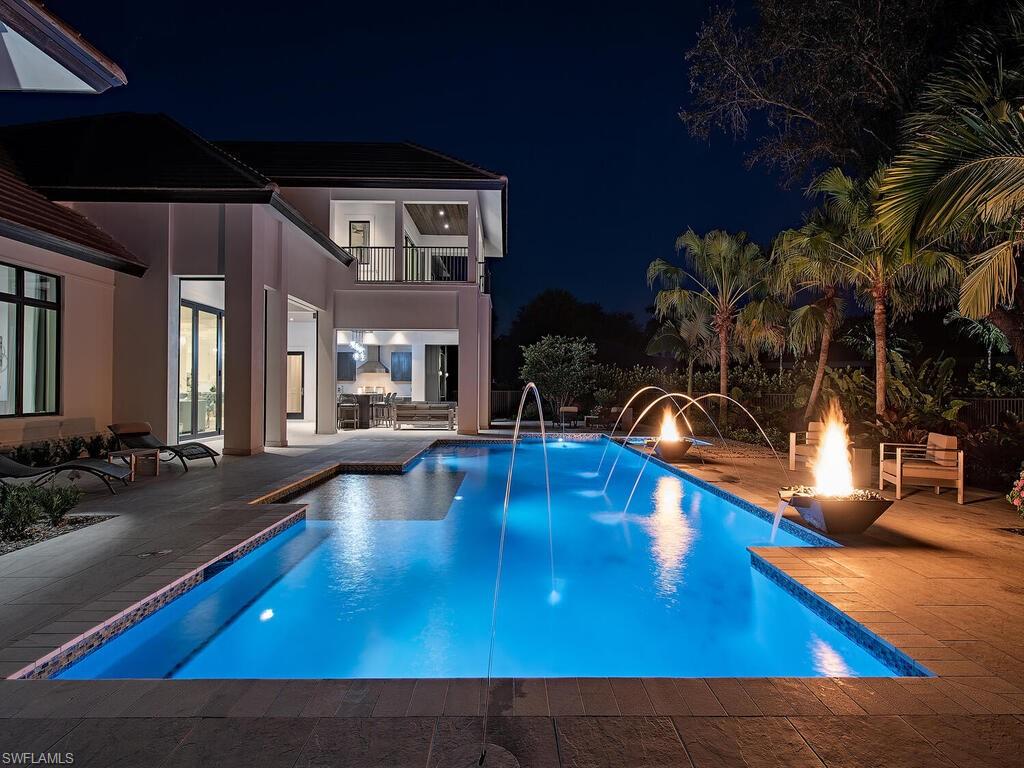 714 Killdeer Place Naples, FL 34108 - Photo 27 of 34 a view of swimming pool with outdoor seating