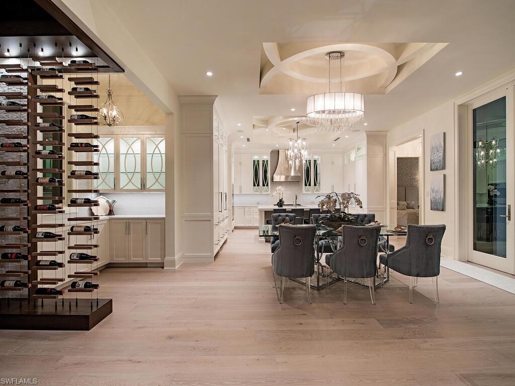 714 Killdeer Place Naples, FL 34108 - Photo 34 of 34 a view of a dining room with furniture and chandelier