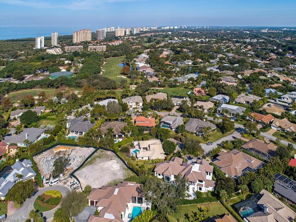 714 Killdeer Place Naples, FL 34108 - Photo 4 of 34 an aerial view of a city with lots of residential buildings