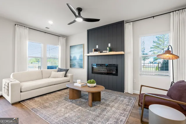 a living room with furniture and a fireplace