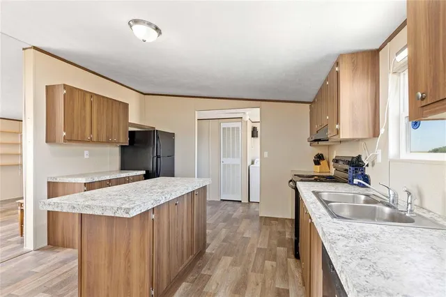 a view of kitchen with furniture and window