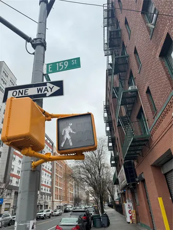 a view of a building with traffic signal lights