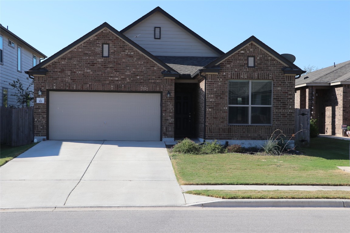 321 Parrot Tulip View Pflugerville, TX 78660 - Photo 1 of 33 a front view of a house with a yard