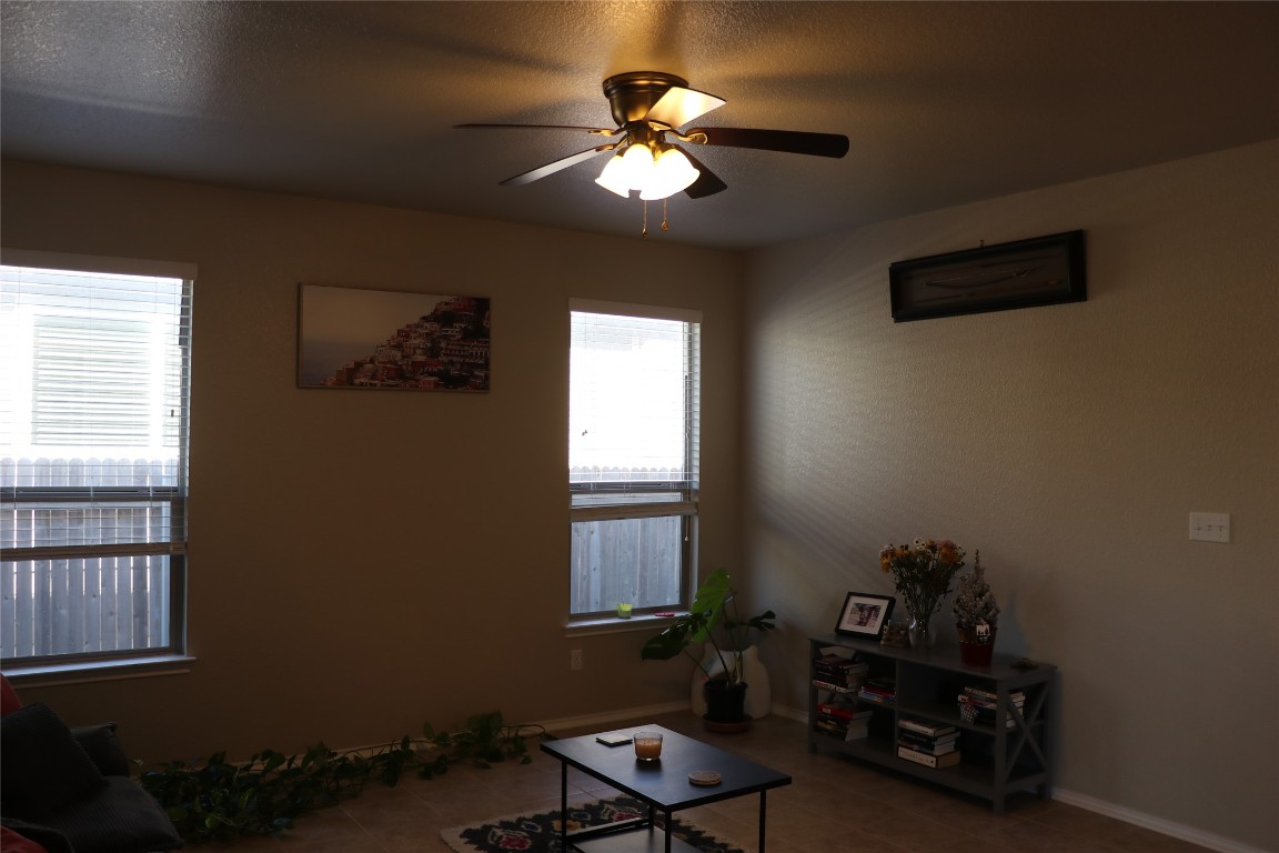 321 Parrot Tulip View Pflugerville, TX 78660 - Photo 11 of 33 a room with furniture and window