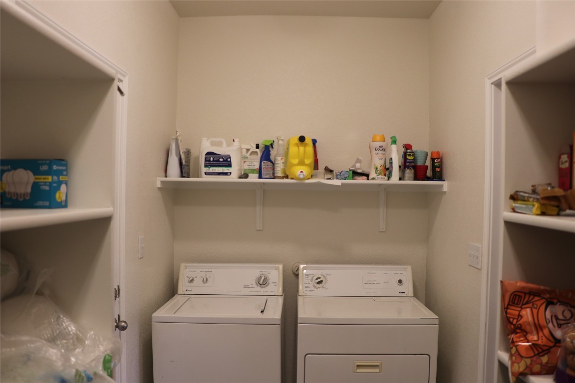321 Parrot Tulip View Pflugerville, TX 78660 - Photo 18 of 33 a utility room with dryer and washer