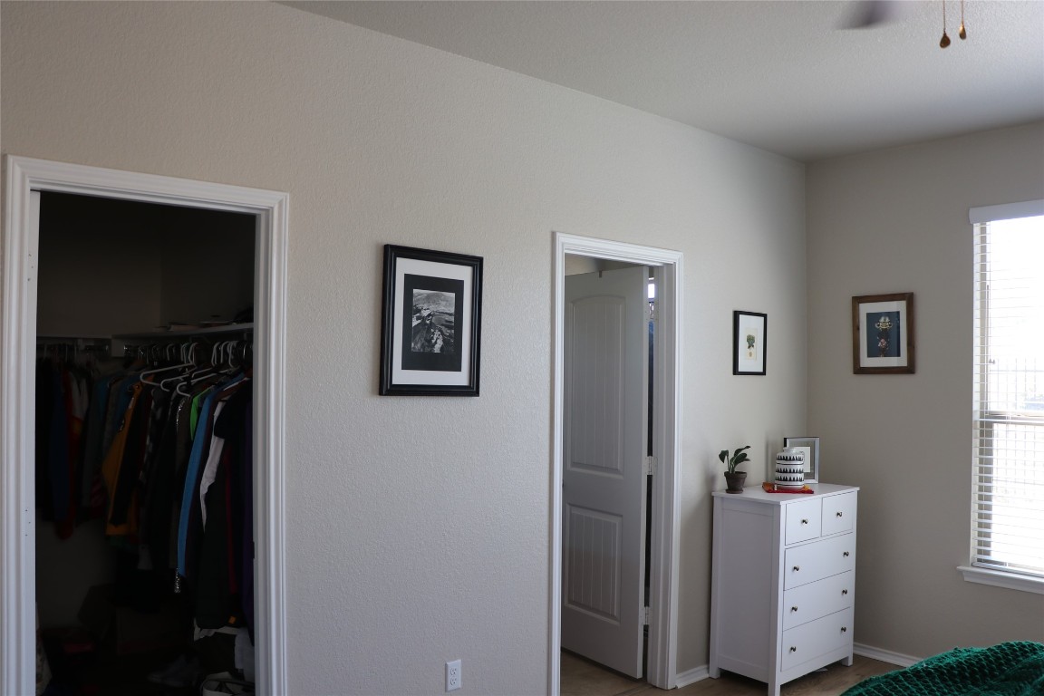 321 Parrot Tulip View Pflugerville, TX 78660 - Photo 23 of 33 a view of a bedroom with closet and a window