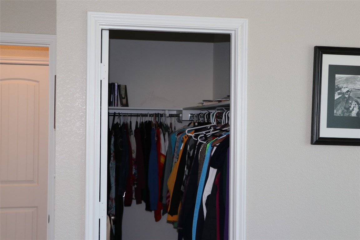 321 Parrot Tulip View Pflugerville, TX 78660 - Photo 25 of 33 a view of walk in closet with clothes