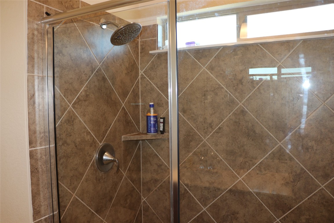 321 Parrot Tulip View Pflugerville, TX 78660 - Photo 27 of 33 a bathroom with a shower
