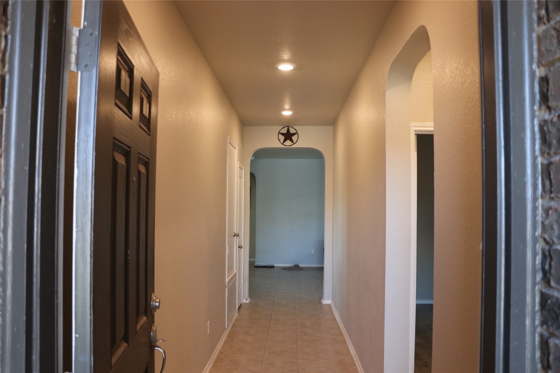 321 Parrot Tulip View Pflugerville, TX 78660 - Photo 3 of 33 a view of a hallway with a elevator