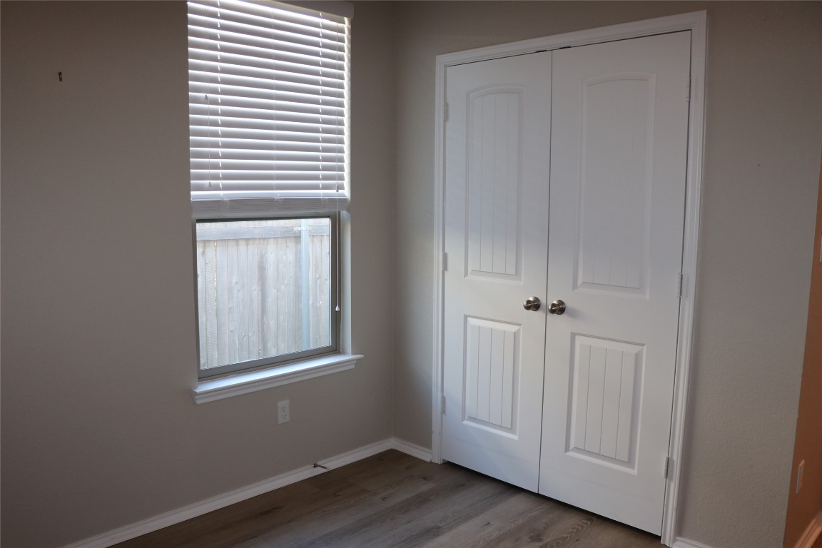 321 Parrot Tulip View Pflugerville, TX 78660 - Photo 7 of 33 a view of an empty room with closet and a window